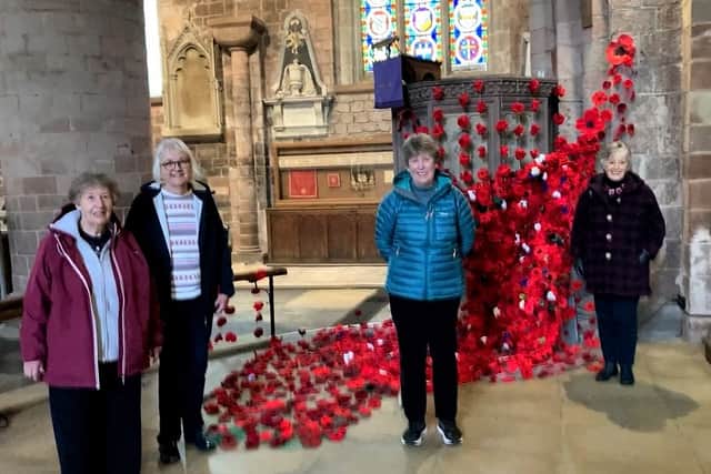 Members of Loton WI with the wonderful display of poppies at Shrewsbury Abbey for Remembrance Day in 2022
