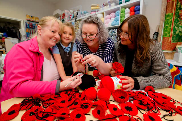 Councillor Kirstie Hurst-Knight coordinating poppies for window displays up and down the High Street in Bridgnorth in 2018. She organised Poppy 'Pop In' sessions at Creative Outlet every Tuesday. In Picture, left to right, Carrieanne Bishop (The Cake Room Bridgnorth), 5-year-old Megan Hale, Emma Mitchell (Creative Outlet) and Councillor Kirstie Hurst-Knight
