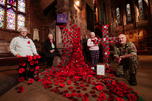A beautiful poppy display created by members of Shropshire WI in 2022 on display at Shrewsbury Abbey. Left to right: Josephine Bennett, Glenys Wheeler (County Chairman), Sue Pearson, Tina Carser and Revd Pat Aldred (Associate Priest)