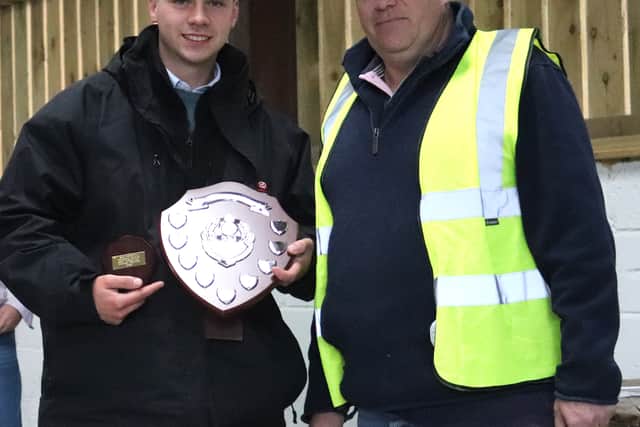 Andrew Ritchie presenting Nathan Davies with the best vintage tractor award