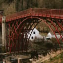The historic Iron Bridge, which is managed by English Heritage and is not part of the Ironbridge Gorge Museums Trust.  It is widely recognised as the world's first arch bridge made entirely out of cast iron. It was constructed across the River Severn in 1779, and it officially opened two years later in 1791. It is recognised as a symbol of the Industrial Revolution. 
