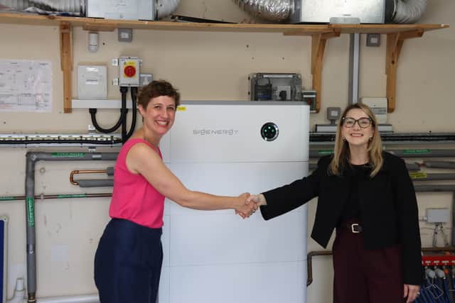 Rachel Stark, Commercial Director of Two Blues Solar, and Astrid D’Amelio, Head of Sustainability at Outcomes First Group, with new battery storage installed at Lamledge School in Shifnal, Shropshire.