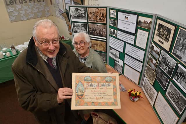 Former Welshampton pupils Christopher Jobson and Vera Lloyd. Mr Jobson is displaying a long service award that his great great great Aunt, Elizabeth Simms, was given when she was a teacher at the school, from 1913. Photo: Steve Leath