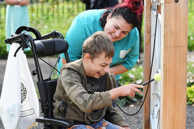 Staff helping bring smiles to children with life-limiting conditions in the space