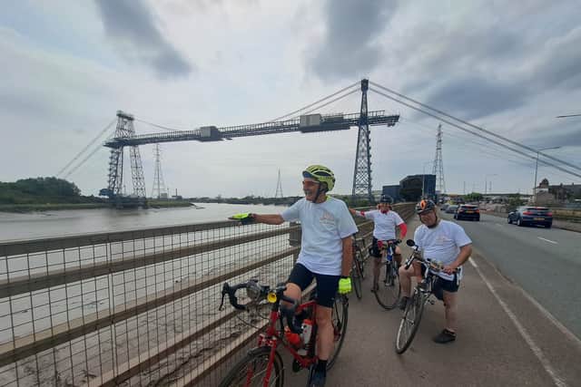 The riders taking a break iby the Transporter Bridge, South Wales