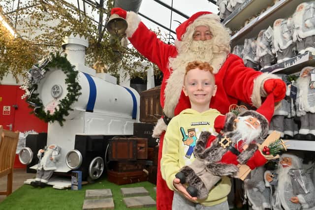 Thomas Michael Carter, 6, with Santa