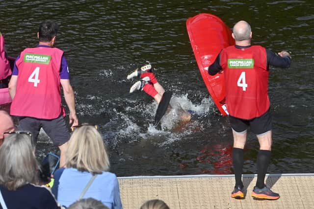 Splash! A racer capsizes near the pontoon