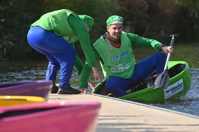 Here comes the green machine: A team makes a swift changeover in the Coracle World Championships
