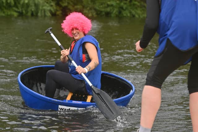 This coracle racer is in the pink