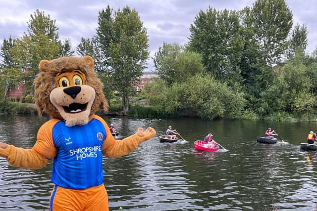 Blue the lion - one of the club's mascots - near the river for the event