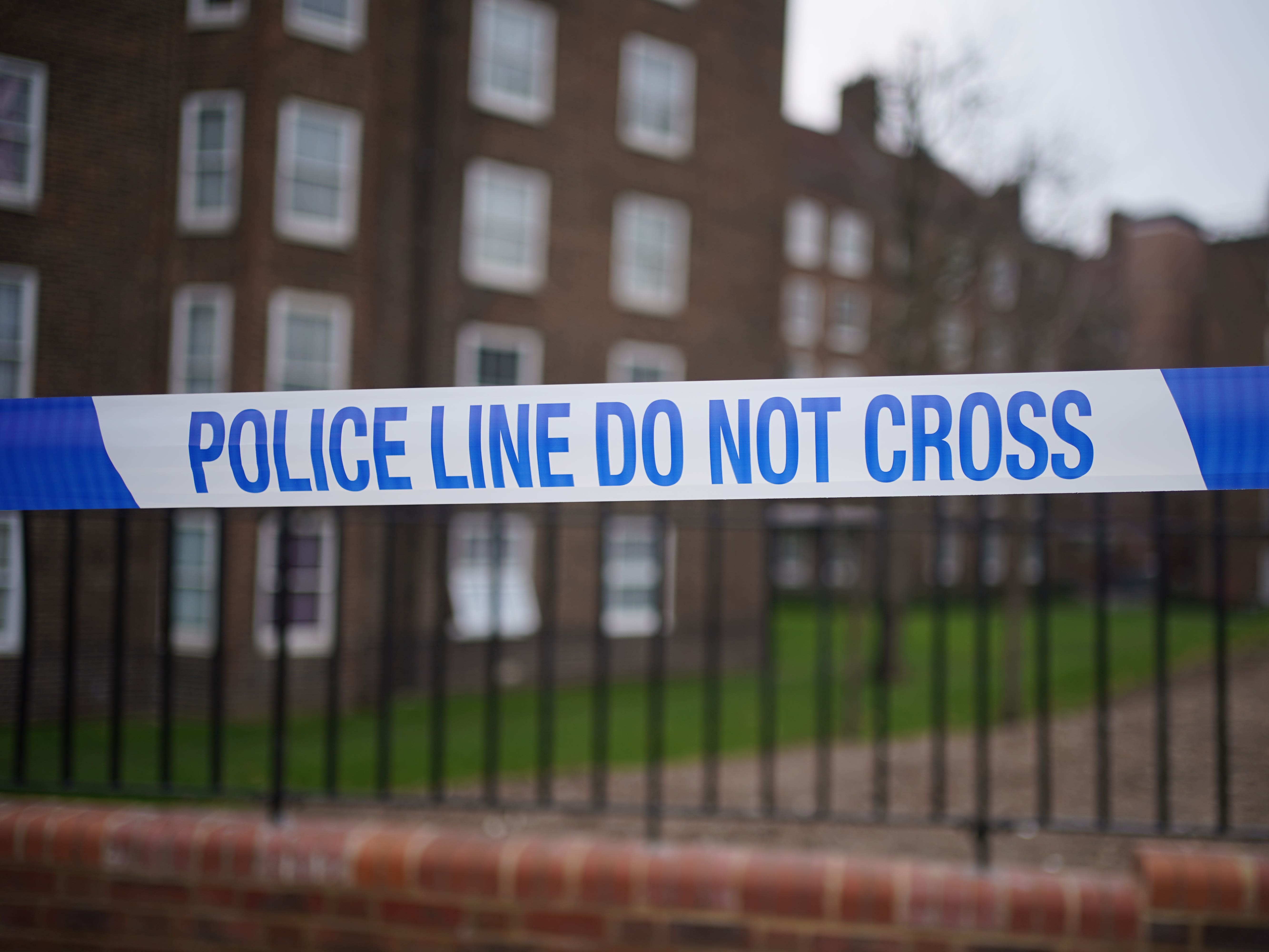 Murder investigation after woman falls from block of flats