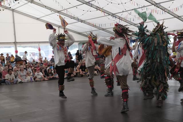 Dancers in vibrant costumes and headgear wow the Shrewsbury Folk Festival audience. Photo: John Hooper