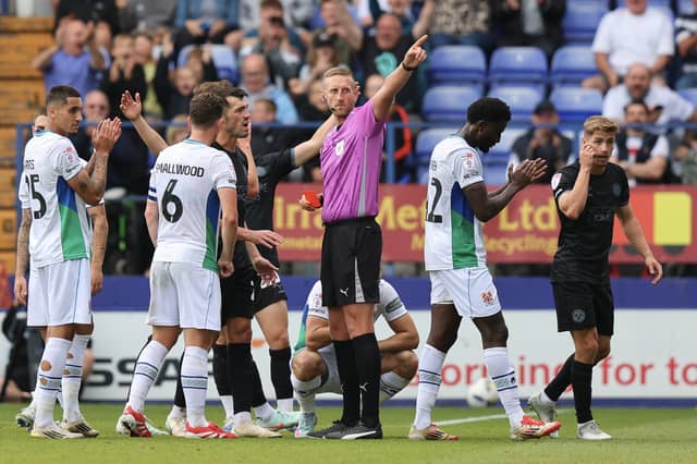 Will Boyle of Shrewsbury Town is sent off for a second yellow card within a minute