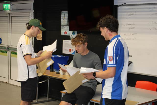 Cole Moore Max Bufton James Stovell receiving their results at Newtown High School