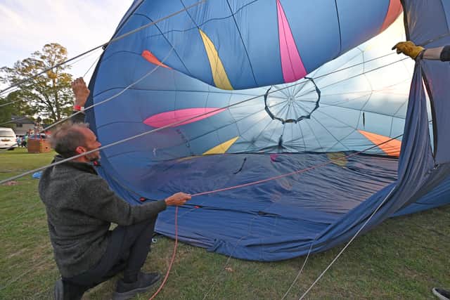 Balloons were inflated to test the wind and it was decided it was too windy to take off. Photo: Tim Sturgess