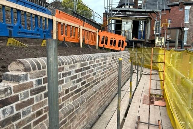 Work has been completed on the part of the wall nearest to the Cliff Railway. Photo: Malvern Tipping