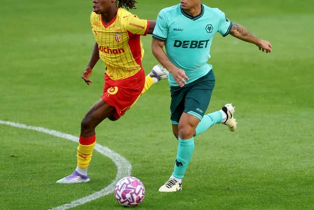 WALSALL, ENGLAND - JULY 30: Wolverhampton Wanderers Joao Gomez and RC Lens Fode Sylla in action during the pre-season friendly match between Wolverhampton Wanderers and RC Lens at Pallet-Track Bescot Stadium on July 30, 2025 in Walsall, England. (Photo by Carl Recine/Getty Images)