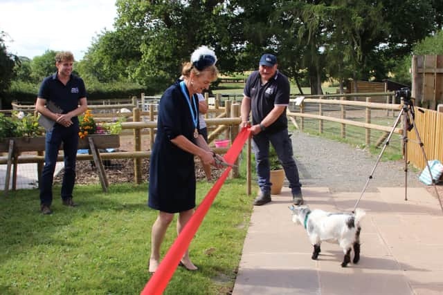 The High Sheriff of Herefordshire Helen Bowden opened the red squirrel enclosure at the Small Breeds Farm Park in Kington avidly watched by a goat