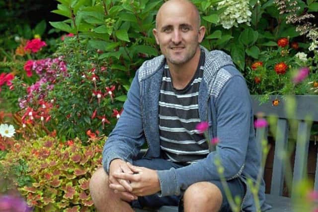 Tom Pountney sat in his garden at Offcot.
