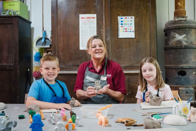 Justine Ranson, Visitor Engagement Team Leader at Coalport China Museum, with Abel Sumnall and Evelyn Wood. Photo: Ironbridge Gorge Museum Trust