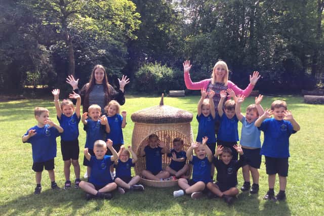 Sheriffhales Primary School and Preschool pupils and staff celebrating its Ofsted report