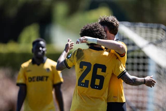 Jorgen Strand Larsen celebrates with Ki-Jana Hoever in Wolves' pre-season training game against Burnley in Portugal (Picture: Wolves)
