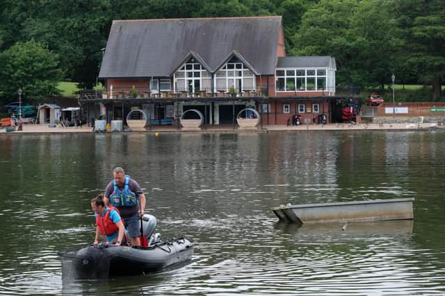 Volunteers out on Llandrindod Wells lake looking for struggling fish. Image by Andy Compton
