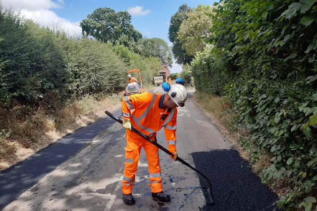 Daniel Wise rakes the road near Stapleton. Picture: LDRS