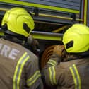 Firefighters rush to a car fire in Bridgnorth. Photo: Victoria Jones/PA