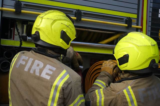 Firefighters rush to a car fire in Bridgnorth. Photo: Victoria Jones/PA