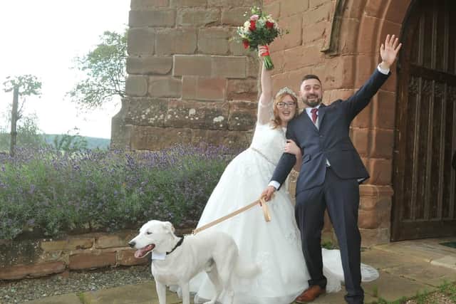 Daniel and Skye Tibbetts with dog Bruno on their wedding day. 