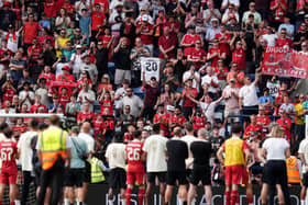 Liverpool fans pay tribute to Diogo Jota as the players watch on following the pre-season friendly at Preston (Martin Rickett/PA)