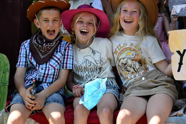 Yee-haw! A cowboys and two cowgirls have fun in the sun at Shifnal Carnival