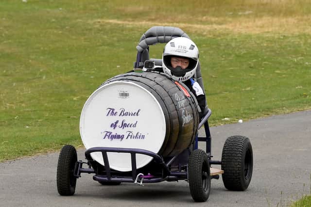 Paul Barnett from Cannock races down the track in his 'Barrel of Speed' the Flying Firkin.