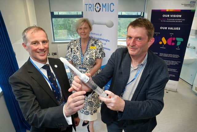 From left: Jon Lacy-Colson (consultant colorectal surgeon), SaTH chief executive Jo Williams and Hugo Lywood (from Origin Sciences). Photo: Steve Leath