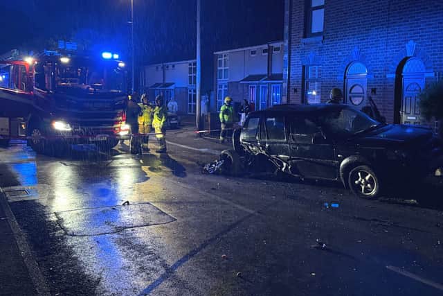 Land Rover left teetering 'precariously' on its side close to several ...