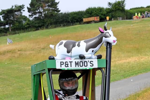 P&T Moo's with their tractor kart, complete with cow on the roof