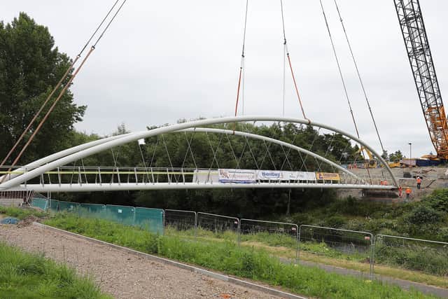The new bridge being lifted into place.
