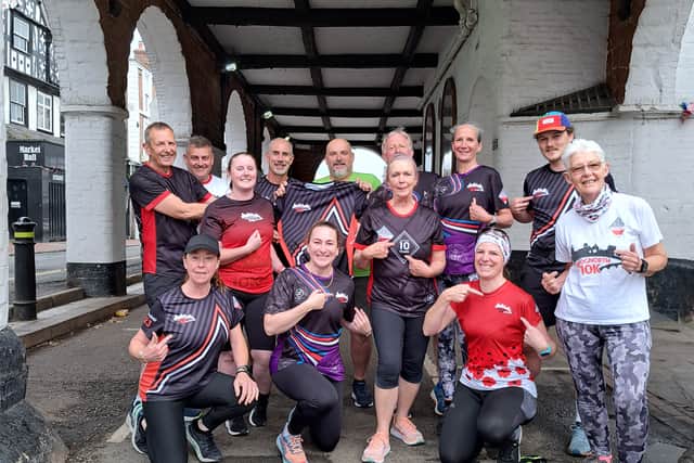 Bridgnorth Running Club members donned different finisher's T-shirts from years gone by to promote this year's race.