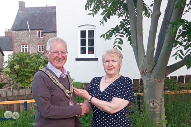 Knighton Mayor Councillor Tom Taylor was congratulated by out-going Mayor Councillor Chris Branford