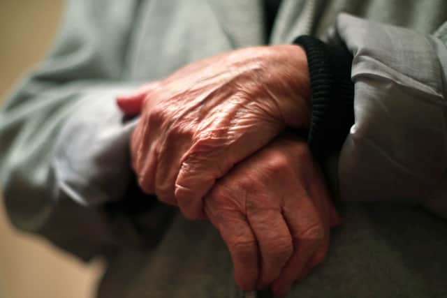 Undated file photo of the hands of an elderly woman. The Government has announced a new commission for reforming social care in England. PA.