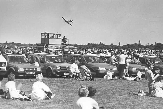 A Spitfire flies low near the crowd at the Cosford air show in June 1988