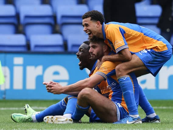 Tom Bloxham of Shrewsbury Town celebrates with his team-mates after scoring a screamer in the 3-0 win against Leyton Orient. (AMA)