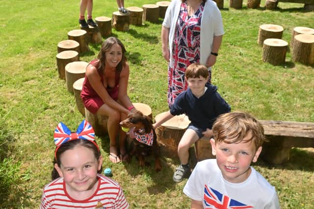 Corbett Primary School, where they have had a special day of events marking the official opening of there new garden. At the front is: Esme 7, Edward 8, Mid: Lucy Timmins with dog Rufus, Harley-Bear 8, Head: Emma Jones, back: Chloe 11 and Nancy 7.