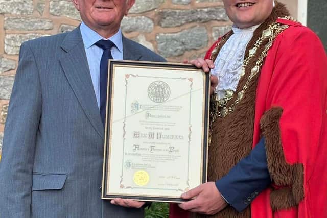 Eric Humphries (left, pictured with new Much Wenlock Mayor, Councillor Dan Thomas), received a Freeman of the Town. Picture: Much Wenlock Town Council