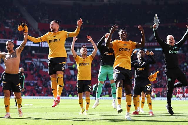 Matt Doherty and Marshall Munetsi of Wolverhampton Wanderers celebrate victory with team mates Joao Gomes, Pablo Sarabia and Nelson Semedo after defeating Manchester United 0-1 (Photo by Wolverhampton Wanderers FC/Wolves via Getty Images)