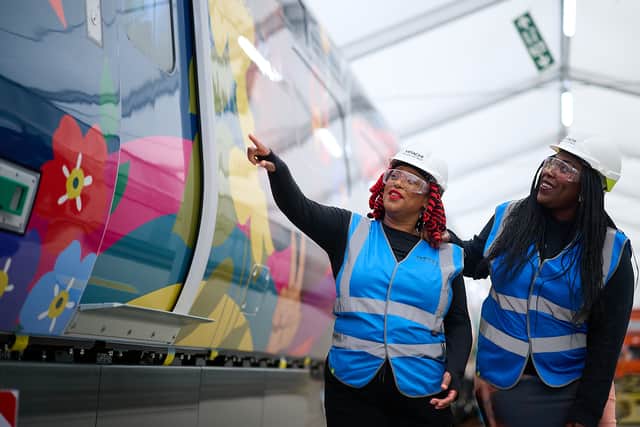 Onboard Chef Marcia Graver (right) at the unveiling of a new train wrapped in a bespoke artwork