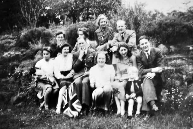 VE Day celebrations at The Old Hall, Dorrington, with Ursula Egerton Hine,  18, second from the left, above the flag. She is wearing a black  skirt made from blackout material with a bit of added braid. Sitting to her left is Marion Nellhaus, a Jewish refugee who had fled Germany 