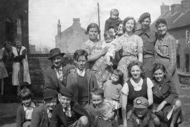 Celebrating the end of the war at 'The Sump' in Oakengates, around Vicar Street and Church Street, was Jean Edwards, second row, second from right and her friends