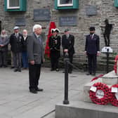 Mike Hiles representing the RAFA pays his respects to the war dead at the cenotaph in Knighton at a previous event. Image: Karen Compton